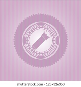 flashlight icon inside pink emblem