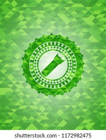flashlight icon inside realistic green emblem. Mosaic background