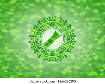 flashlight icon inside realistic green emblem. Mosaic background