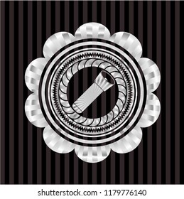 flashlight icon inside silver emblem