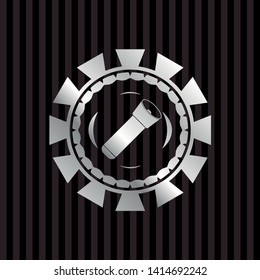 flashlight icon inside silver emblem