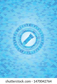 flashlight icon inside sky blue emblem. Mosaic background