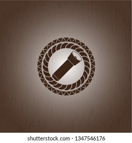 flashlight icon inside wood badge or emblem