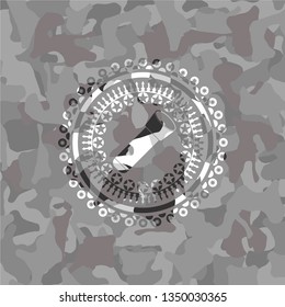 flashlight icon on grey camouflaged pattern