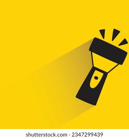 flashlight with shadow on yellow background