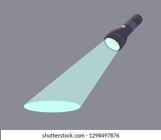 The flashlight shines on the floor. Flashlight isolated on grey background.
