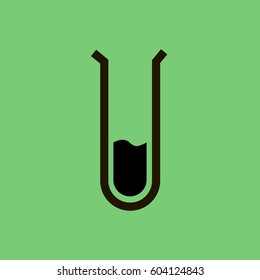 Flask with liquid on green background