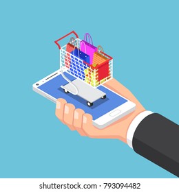 Un hombre de negocios isométrico de 3D con bolso de compra y carro en el smartphone.Concepto de compras en línea.