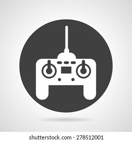 Flat black round vector icon with white silhouette game controller on gray background. 