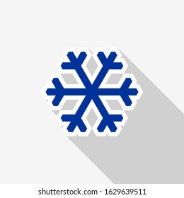 Flat blue snowflake icon with white outline and long shadow on a white background.