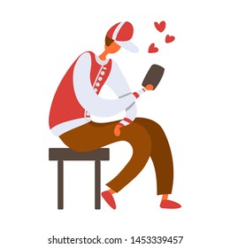 Flat cartoon man sitting on a stool and holding a smartphone.