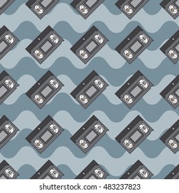 Flat color vector seamless pattern videocassette. Fabric textile elements. Cute doodle with analog multimedia. Vector illustration, element for design. Retro. Interference. Television. Magnetic tape.