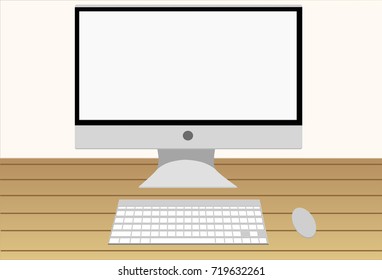 Flat computer with wireless keyboard and mouse on wooden table on white.