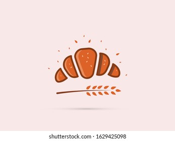 flat croissant icon with spikelet and sesame seeds on a uniform pale background