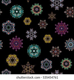 Flat design of blue, green and neutral snowflakes isolated on black background. Snowflakes pattern. Snowflake seamless pattern. Vector snowflakes background.