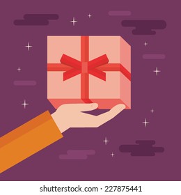 Flat design colorful vector illustration of hand holding gift box isolated on bright background