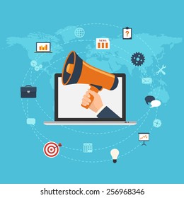 Flat design digital marketing concept. Hand holding megaphone coming out from laptop