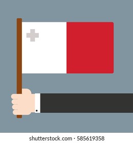Flat design. Hand holding flag Malta
