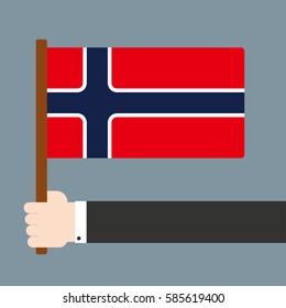 Flat design. Hand holding flag Norway