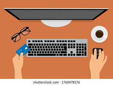 Flat design illustration of hand holding credit card, keyboard and computer mouse. Monitor on orange table top. Suitable for banner about shopping - vector
