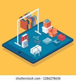 Flat design isometric online shopping e-commerce concept: tablet, boxes, shoes, clothes on hanger and rack, shopping bag.  Boutique, clothing store.Can be used for hero images and web sites and apps