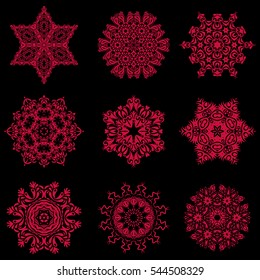 Flat design of red snowflakes isolated on black background. Vector snowflakes background. Snowflakes set.