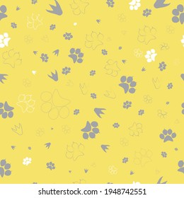 Flat design seamless pattern. Yellow, grey and white vector illustration paw, dinosaur, bird footprint. For fabric, bag, laptop, notebook, phonecase. Background, wallpaper.