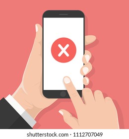Flat design style human hand  holding smartphone or tablet with Red cross mark on the screen , vector design element illustration