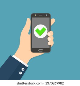 Flat design style human hand holding smartphone with green check mark on the screen