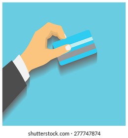 Flat design style illustration. Hand hold credit card to pay. Vector illustration, isolated on blue 
