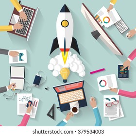 Flat design. top view of team of coworkers working together around a desk.working with laptop and tablet and smarth-phone to launch a new business project and new innovation product on a market.