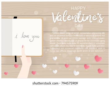 Flat design Valentine's card with hand holding diary with text I love you. Wooden table background with hearts in pink and white color. Vector illustration. 