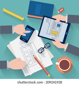 Flat design vector illustration. Business workplace with people hand, cup of coffee, digital tablet, smartphone, papers and various office objects on table.