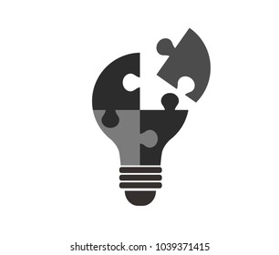Flat design vector illustration of a lamp made from pieces of a puzzle.