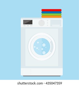 Flat design vector illustration of modern washing machine with pile of clothes. Clothes stack. Washing clothes