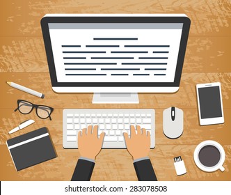 Flat design vector illustration of workplace. Top view of wooden  desk with  a computer and typing hands over a keyboard and office objects around