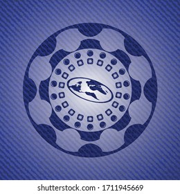 flat earth icon inside badge with denim background. 