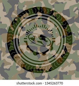 flat earth icon inside camouflage emblem