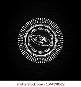flat earth icon inside chalk emblem written on a blackboard