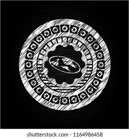 flat earth icon inside chalkboard emblem written on a blackboard