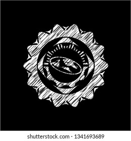 flat earth icon inside chalkboard emblem written on a blackboard