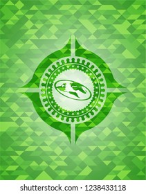 flat earth icon inside green emblem with mosaic background