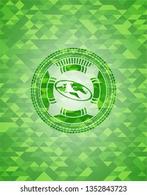 flat earth icon inside realistic green emblem. Mosaic background