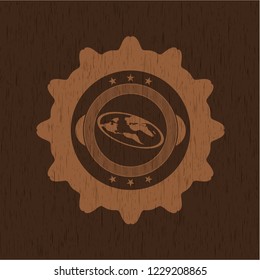 flat earth icon inside wooden emblem