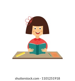 Flat girl kid studying sitting at table holding textbook with pencils and notebook at desk. Happy teen female child student smiling. School education concept. Vector illustration