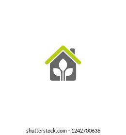 Flat gray home with leaves inside. Simple silhouette of the house with green roof and chimney. Icon isolated on white. Vector building symbol. Eco friendly house. recycle and reuse home sign.