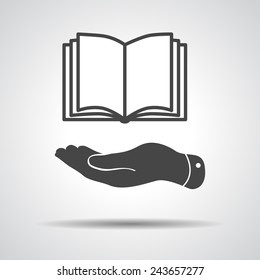 flat hand showing book icon on a grey background