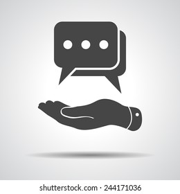 flat hand showing chat icon on a grey background