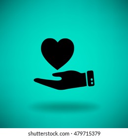 Flat icon. Heart on hand.