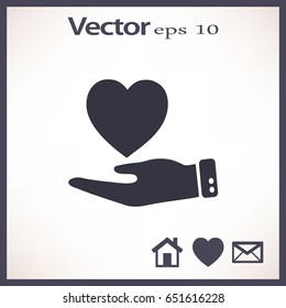 Icono plano. Corazón a mano.